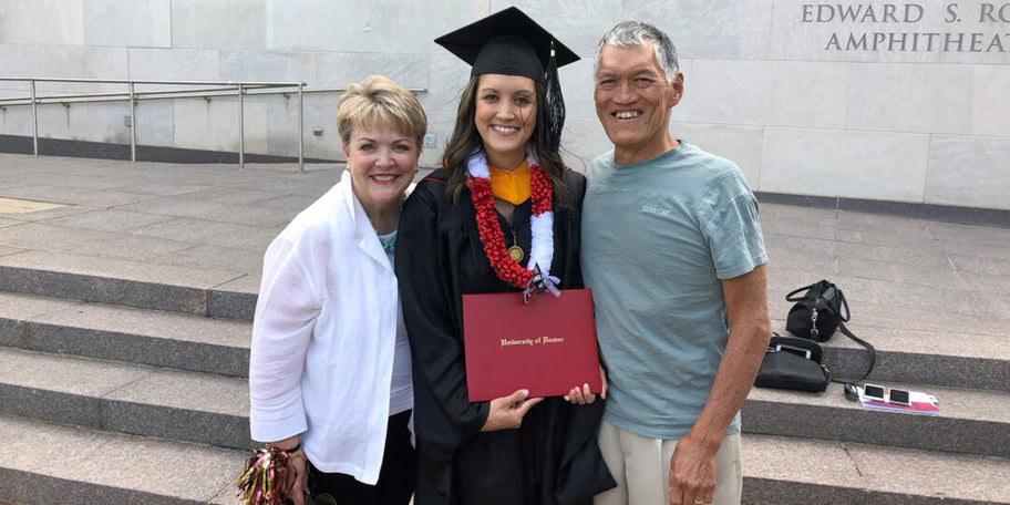 Samm Peterson and parents at University of Denver commencement