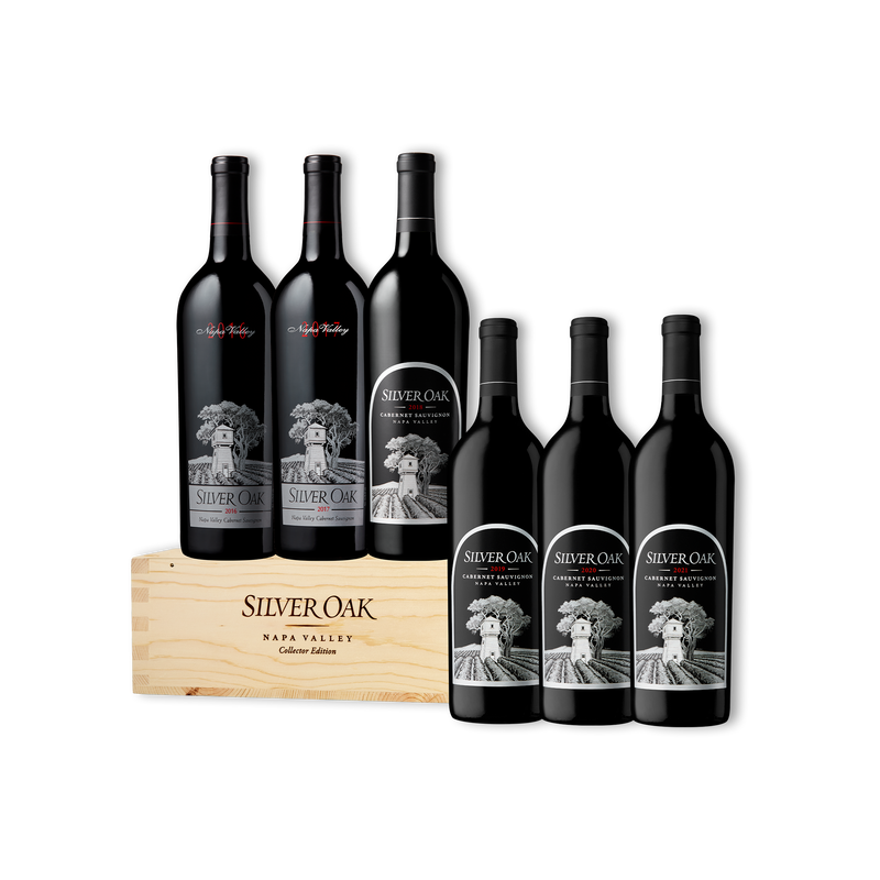 Six Silver Oak Napa Valley Cabernet Sauvignon wine bottles arranged with an engraved wooden collector's edition box
