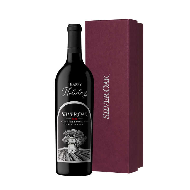 Happy Holidays etched bottle of Silver Oak Napa Valley Cabernet Sauvignon with a burgundy gift box