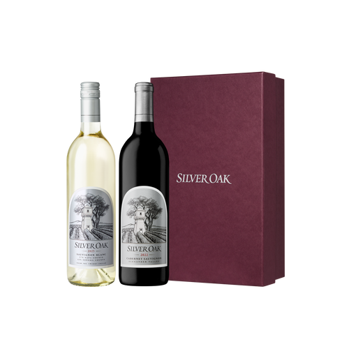 A bottle of Silver Oak Sauvignon Blanc and Alexander Valley Cabernet Sauvignon with a burgundy gift box | Cabernet & Sauvignon Blanc Holiday Gift